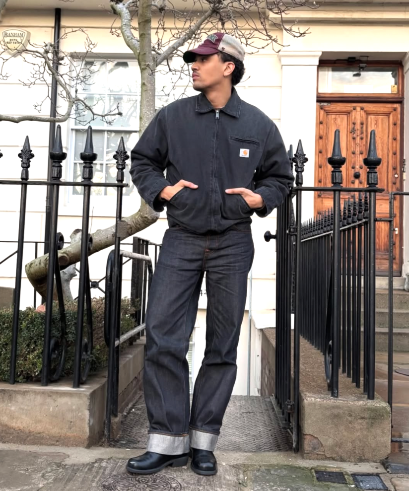 Workwear jacket with cuffed jeans and leather boots